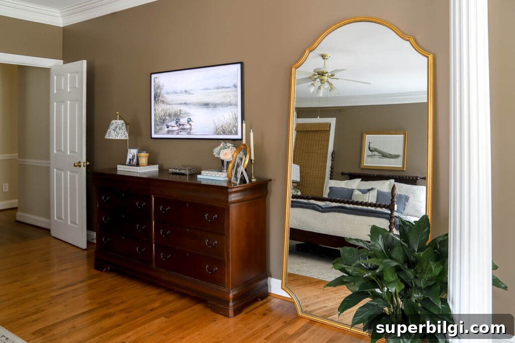 how to style a leaning mirror between a dresser and a column.