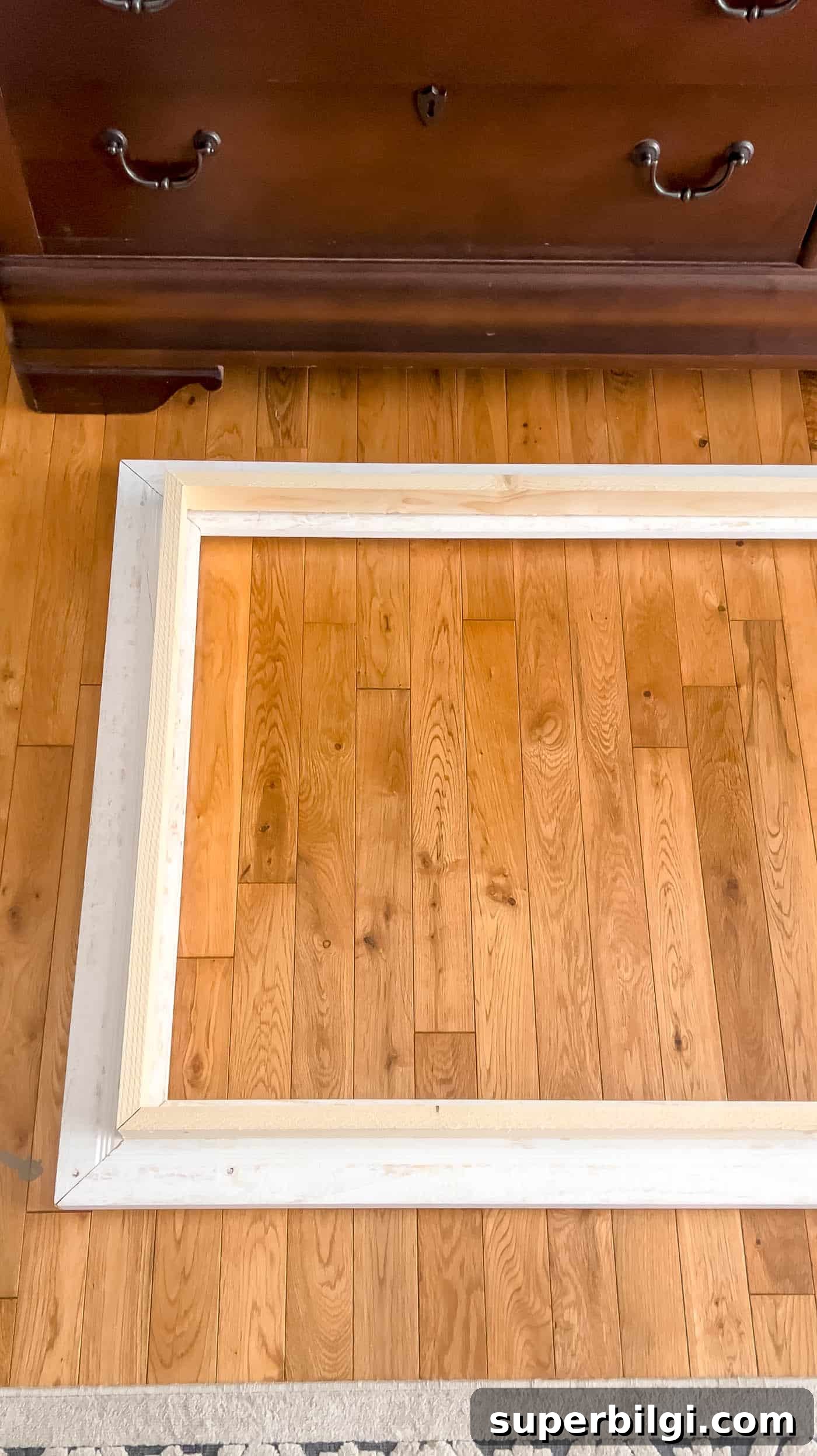 building a frame on the wood floor.