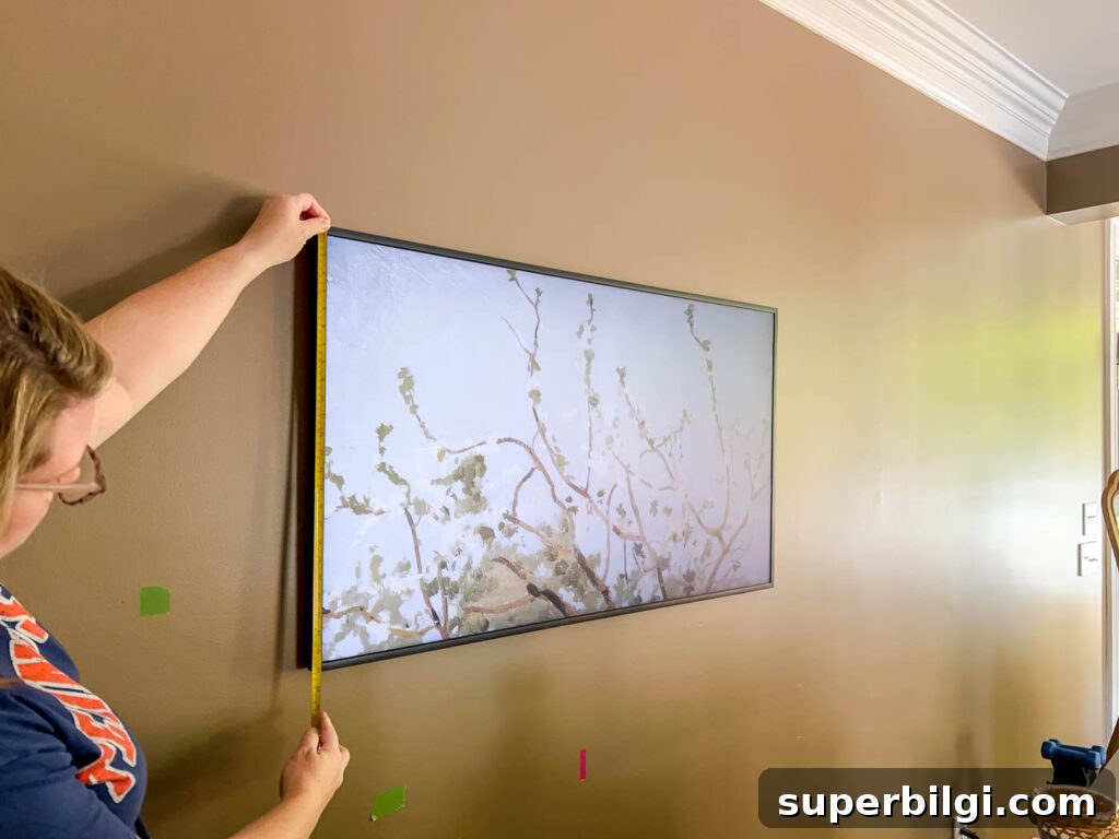 measuring the Frame TV to make a frame.