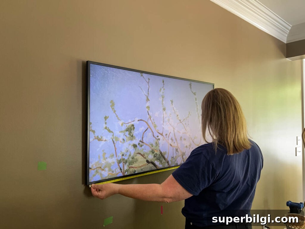 measuring the Frame TV to make a frame.