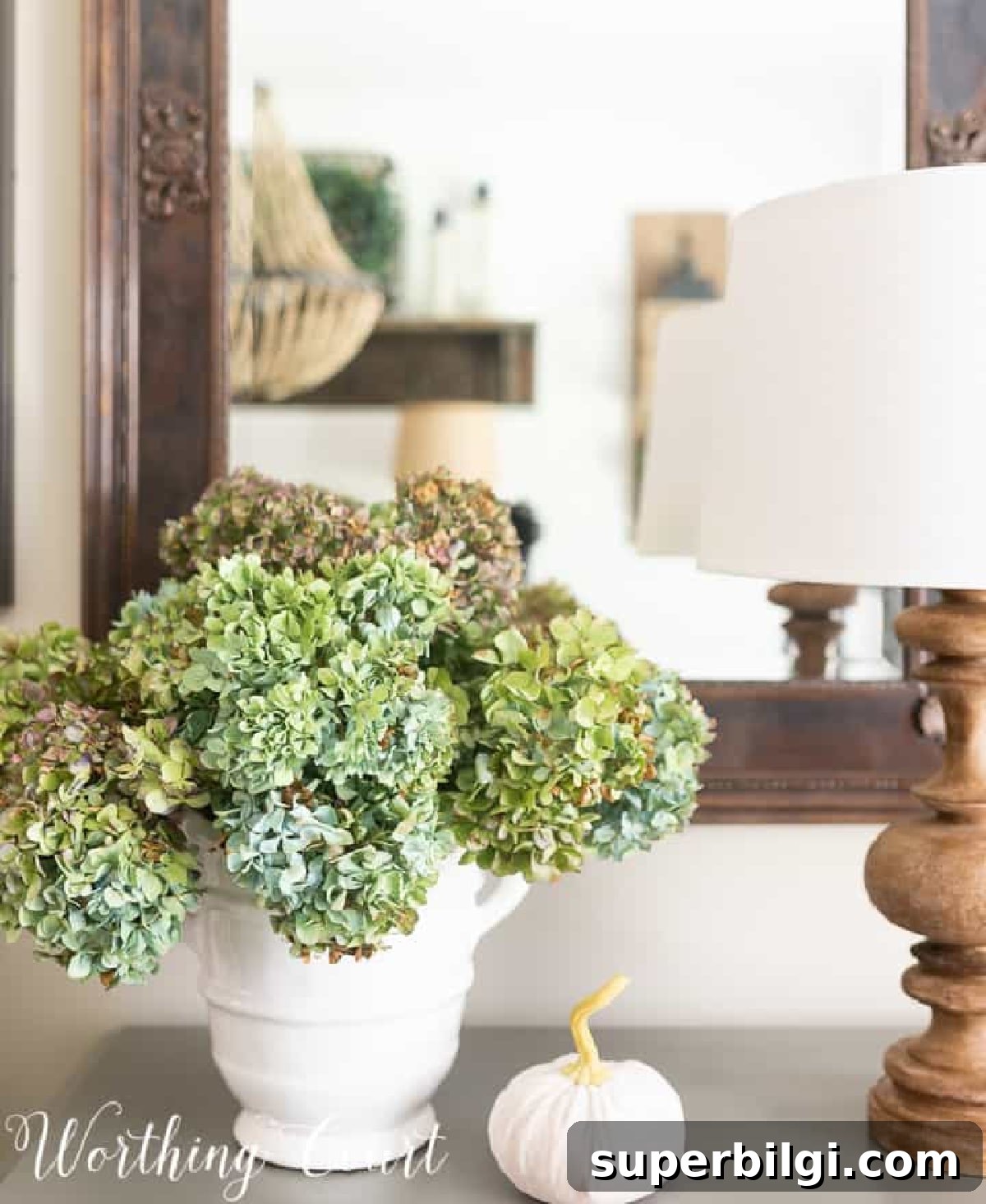 Cozy Fall Decor Ideas for Every Room + Comforting Recipe 6 fall pumpkin and blue and green hydrangeas with a wooden lamp